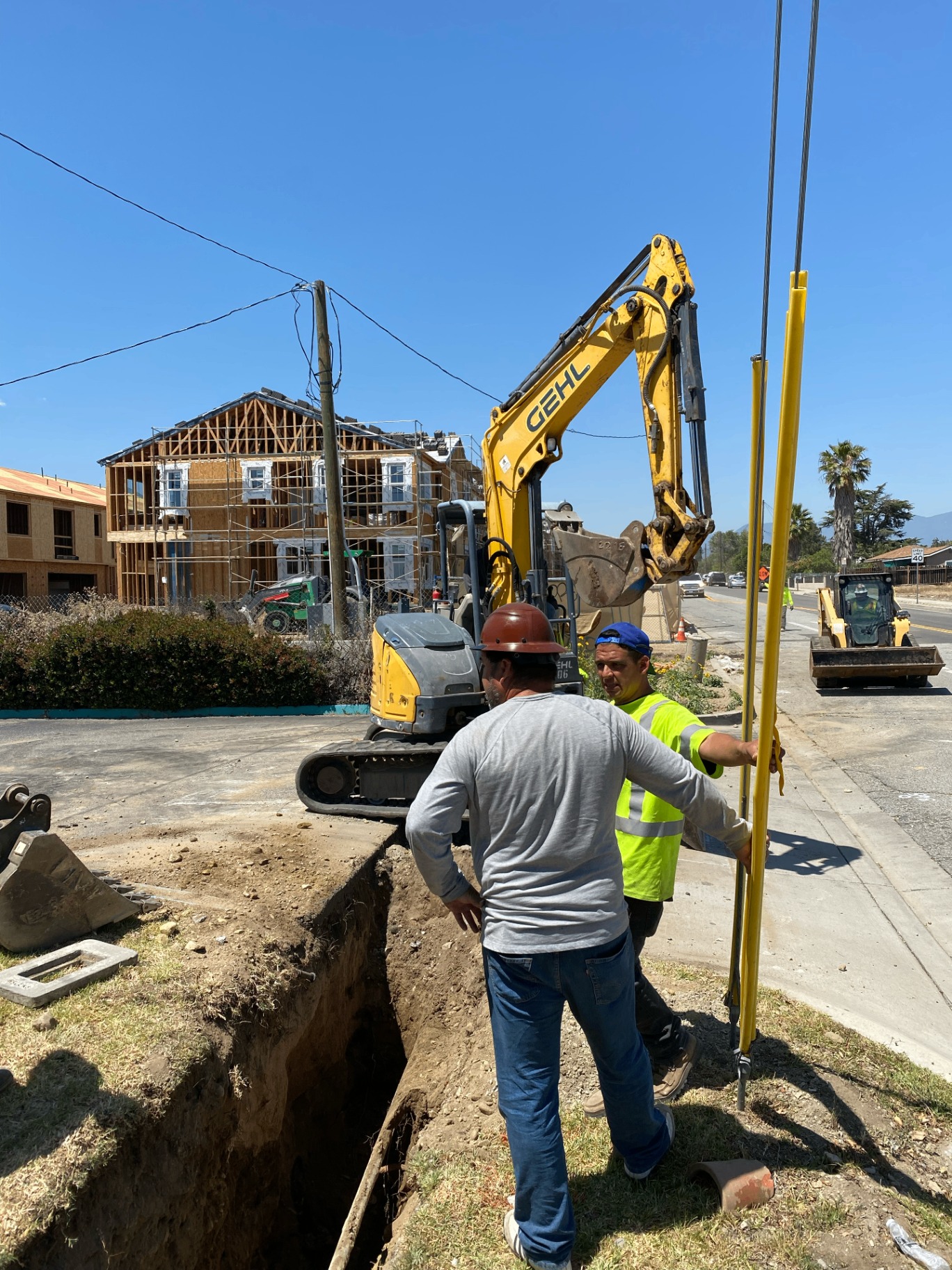 JAQP construction crew and equipment on a residential job site